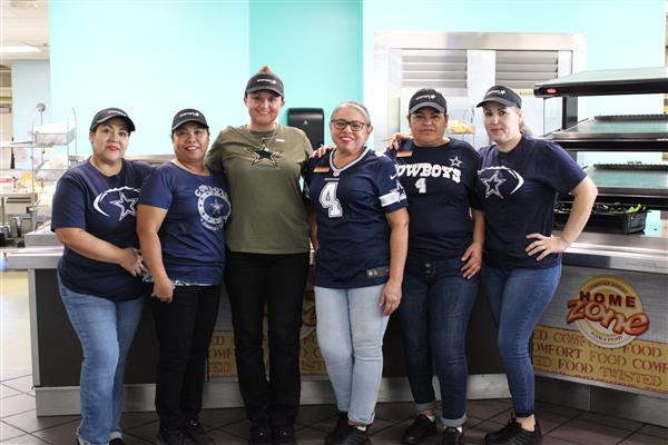 The Aramark cafeteria ladies at Bishop HS wear blue in honor of KISD Coach Marco Contreras.